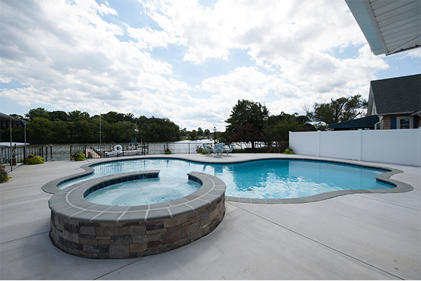 custom-backyard-installation-hottub-and-pool-type-of-inground-pool